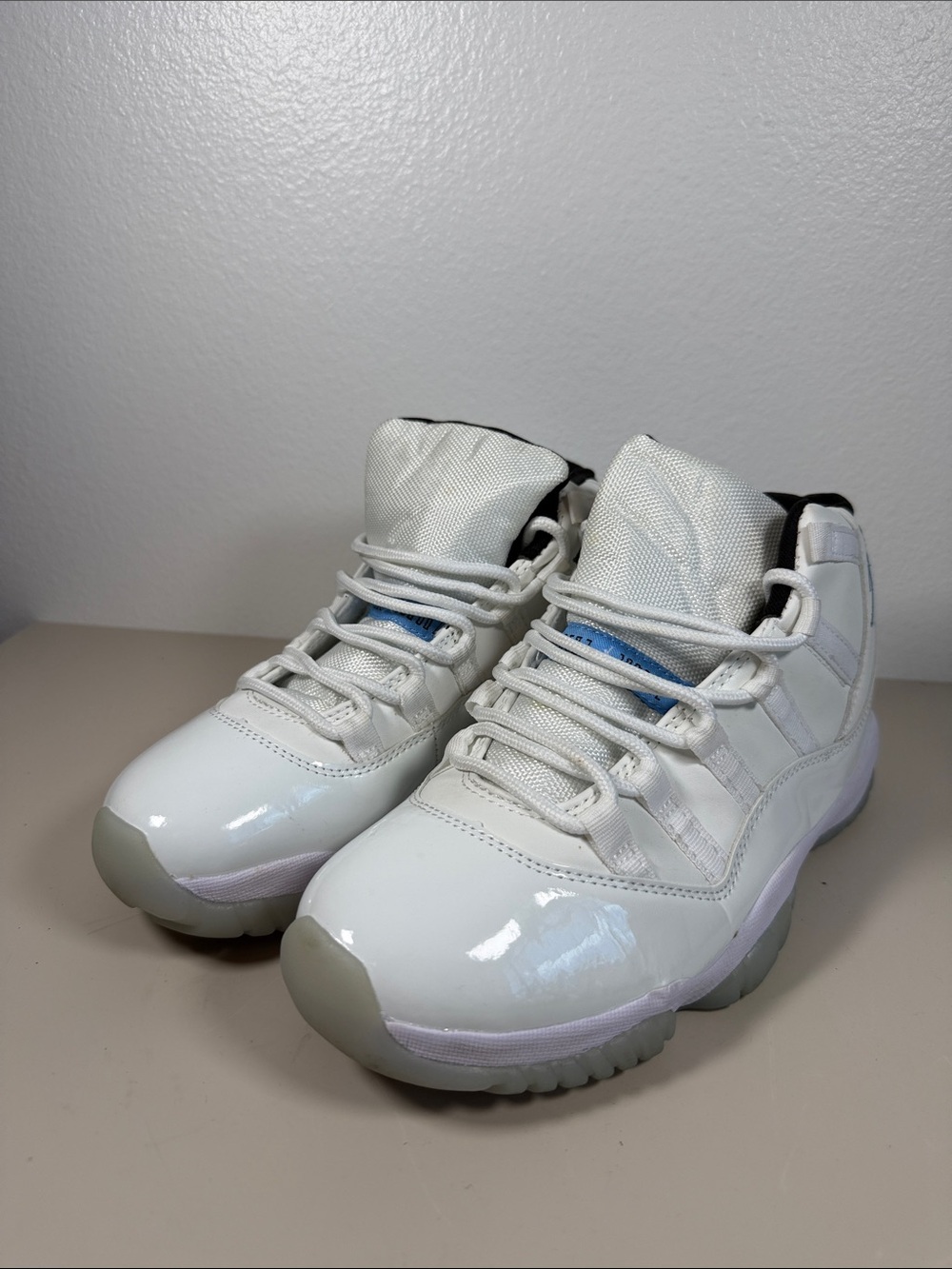 Air Jordan 11 Retro Legend White and Light Blue Patent Leather Sneakers
